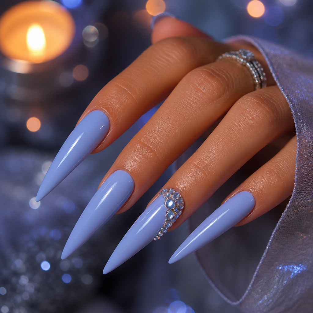 Dramatic long stiletto nails in glossy blueberry milk with clear rhinestone clusters