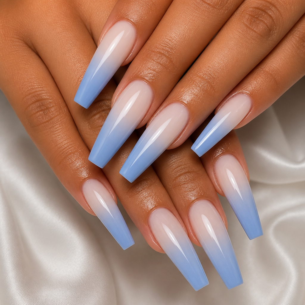 Long coffin nails with a flawless milky blue ombre fade