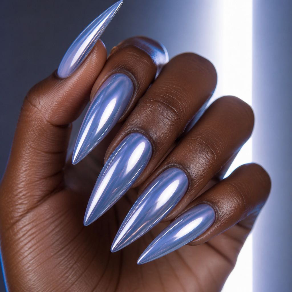 Long stiletto nails with highly reflective metallic silver-blue chrome over blueberry milk