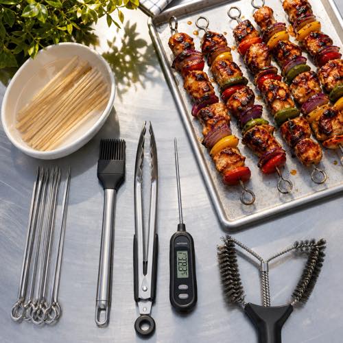 Outdoor barbecue grilling equipment including bamboo skewers, tongs, and silicone basting brush