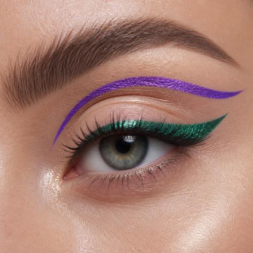 Mardi Gras makeup idea 12: Colourful Floating Graphic Eyeliner with purple, green, and gold carnival styling